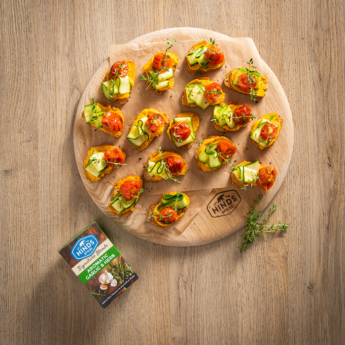 Aromatic Garlic & Herb Bruschetta with Carrot Hummus, Tomato and Pickled Courgette