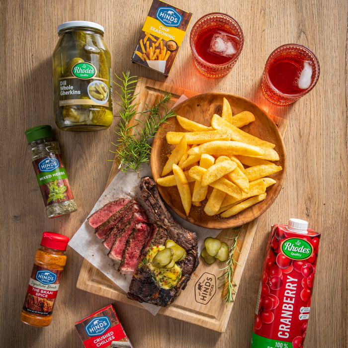 Flame-grilled Mustard Sirloin Steaks, Topped with Herb Butter and Gherkins